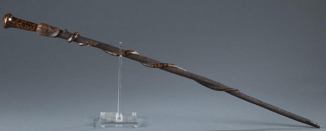 Carved Folk Art Snake Cane, 19th/20th c.: A carved folk art snake cane, late 19th/early 20th century. Mexican. Burled maple knob handle with carved duck head & burled painted carved snakes entwined around a carved maple cane. 37" l.