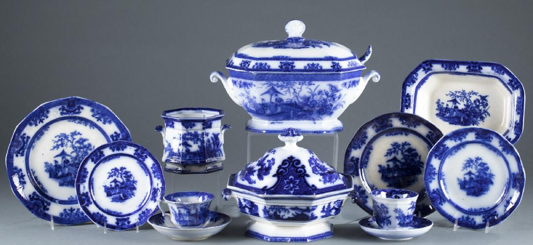 Amoy Davenport Flow Blue Ironstone Service.: An Amoy Davenport flow blue ironstone willow pattern incomplete service, c.1850s-1870s. All marked with "Amoy" on base & some with "Davenport" impression. To include: eight saucers + two handled cover