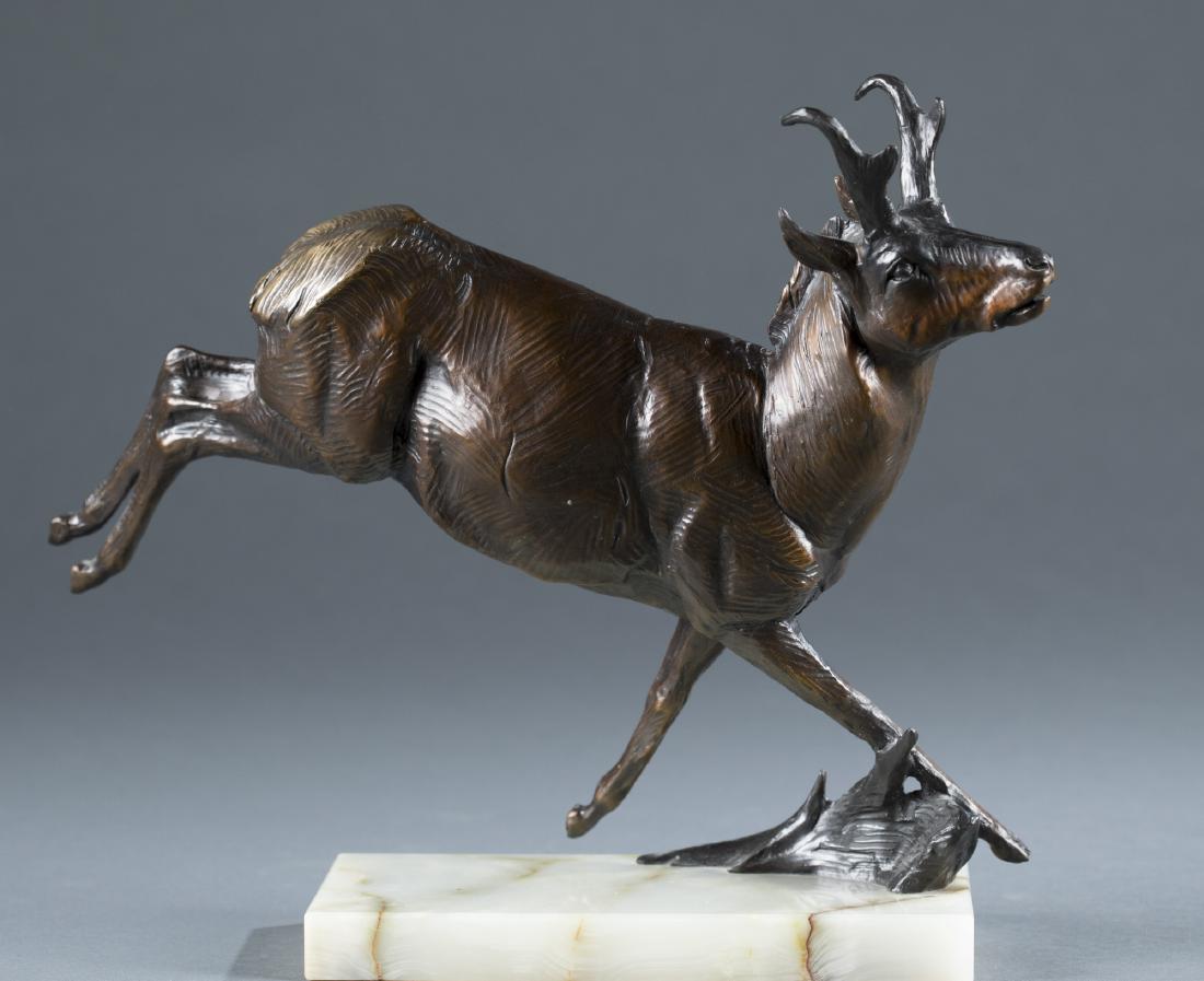 Dan Ostermiller (USA, 20th c.) Pronghorn Bronze.: Dan Ostermiller (United States, 20th century) pronghorn ram bronze on marble base, c.1992. Signed in mold on base with "CRR 29." 10 1/2" h x 12 1/2" l x 4" w.