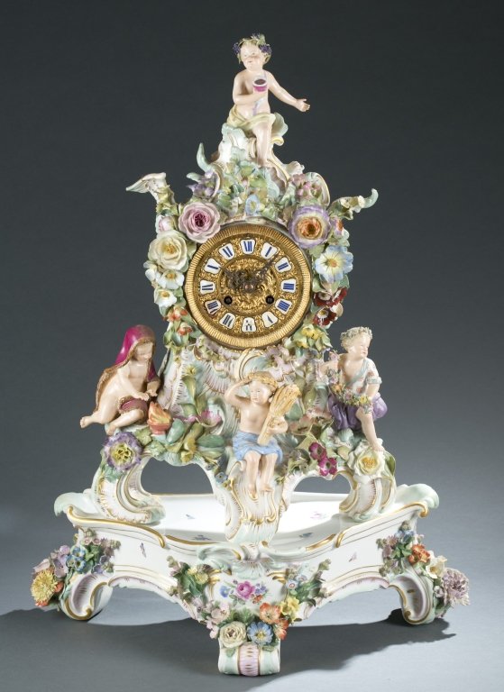 Meissen Figural Seasons Mantel Clock, Late 19th c.: A Meissen Rococo Revival porcelain pendulum floral mantel clock, late 19th century. The four seasons are depicted in allegorical themes with putti; fall is holding a sheath of wheat, spring holds a fl
