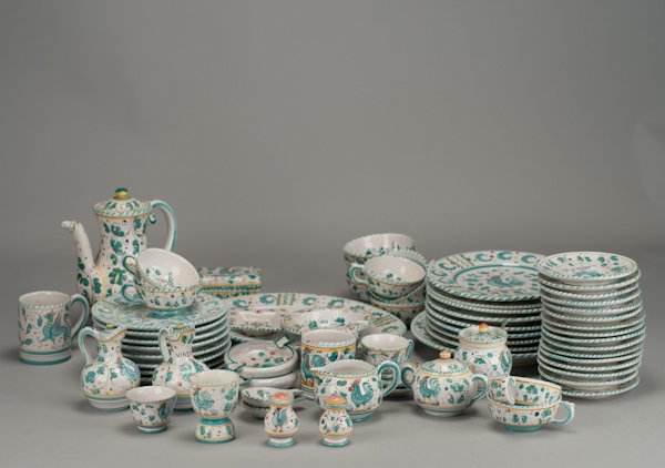 A Fifty-Eight Piece Green Rooster Pattern Deruta D: A Fifty-Eight Piece Green Rooster Pattern Deruta Dining Service to Include: expresso pot, sugar bowl, creamer, honey pot, two salt and pepper shakers, egg cup, lidded box marked Pervaia Italy, two mug