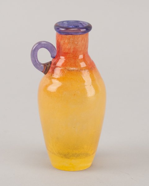 Kosta Boda by Kjell Engman Artist Collection Handl: Kosta Boda by Kjell Engman Artist Collection Handled Bottle. Kosta Boda label and signed on base Kosta Boda Artist Coll K Engman 89061. 4 3/4" H x 2 1/2" dia.