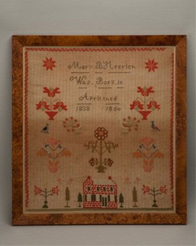 A M 19th C Cross Stitched Sampler,: A M 19th C Cross Stitched Sampler, reading ""Mary B. Newrich Was Born in April the 6 1838 1850"" with motifs of a brick house, trees, peacocks, lovebirds, potted flowers a red border, etc, worked in w