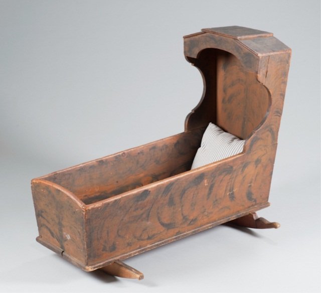 Painted American Hooded Cradle.: Late 18th C. Black tree of life, sponging on red. Square cut nails. Pennsylvania or New England. Forged nail construction. 33" H x 39" W x 14 3/4"D.