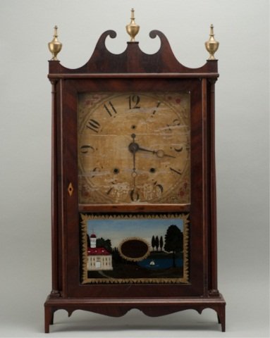A 19th C Eli Terry Pillar and Scroll Mahogany Mant: A 19th C Eli Terry Pillar and Scroll Mahogany Mantle Clock, with a painted face (peeling), an eglomise lower panel to the door with a house in a landscape, brass urn finials, wood works (not working),
