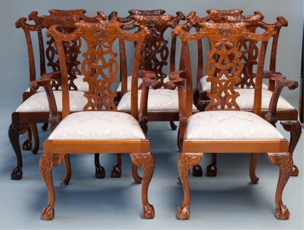 Eight Irish Chippendale-style Dining Chairs,: Eight Irish Chippendale-style Dining Chairs, two arms and six sides, all heavily carved with ivory damask upholstered drop-in seats.
