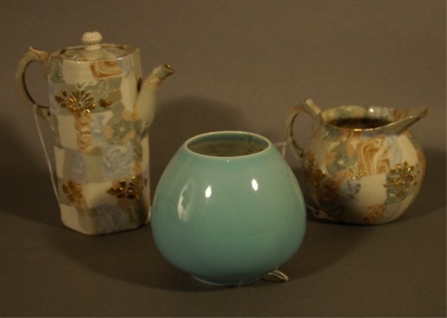 A 1951 Rookwood #6514E Vase and A Ceramic Teapot: and creamer. Matching design with embossed Asian mark on base of teapot. Flame mark to base of Rookwood vase.