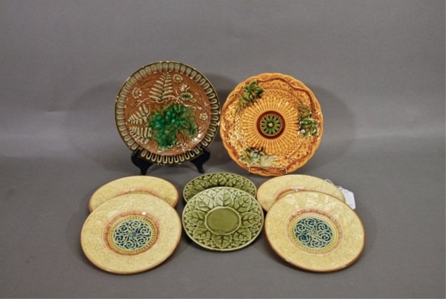 Eight Majolica Plates: two by Sarreguemines, four by G.S. Zell. Various sizes. Chips.