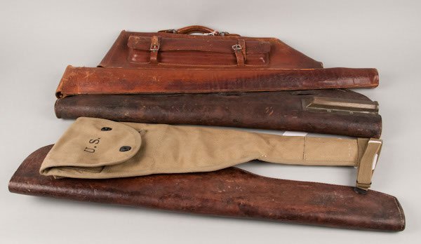 Collection of leather gun cases including 1 shotgun: Collection of leather gun cases including 1 shotgun leather case; 2 military carbine leather cases; 1 carbine leather case. All in good condition. Some straps missing from carbine leather cases.