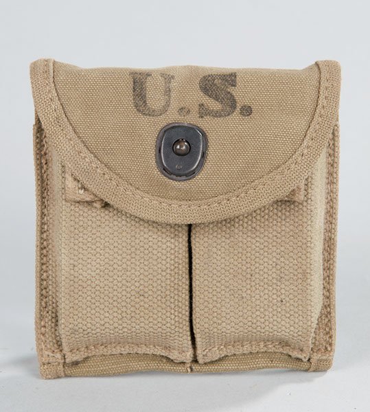 World War II US Army M-1 Carbine canvas clip pouch: World War II US Army M-1 Carbine canvas clip pouch complete with two carbine clips. Maker marked and dated 1943.