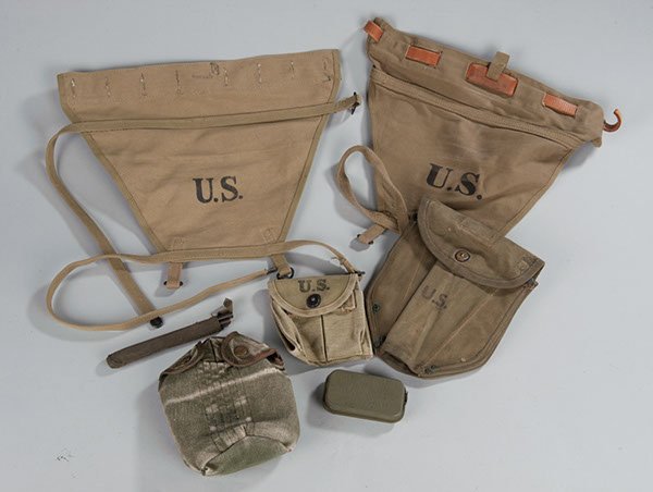 Lot of US Army military items including rifle clea: Lot of US Army military items including rifle cleaning rods in cloth case; M-1 Carbine clip pouch without clips; Carlisle Model First Aid Packet; two (2) Army pack flaps, Vietnam-era canteen cover wit