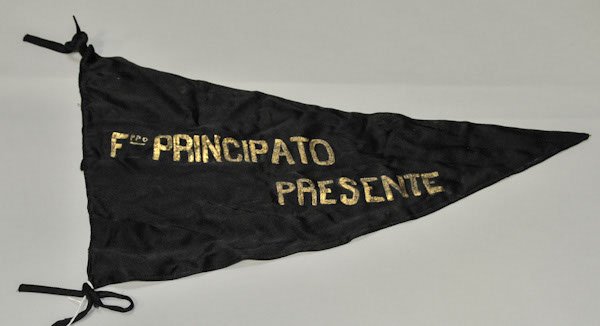 World War II Italian black pennant with the name o: World War II Italian black pennant with the name of a deceased soldier written in gold letters along one side. The man‚ name was ‚ Fppo Principato.‚ Measures approximately 22-inches long and has