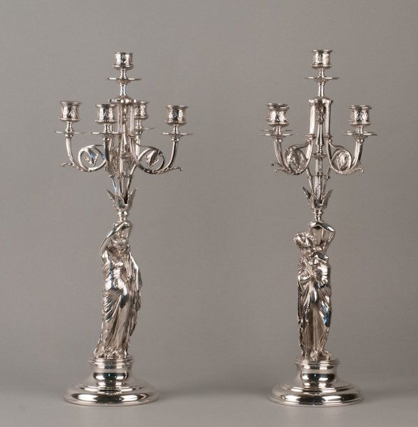 Pair of French Silver Plate Figural Candelabra, af: Pair of French Silver Plate Figural Candelabra, after Jean Jacques Pradier (Swiss 190 - 1852), Late 19th Century, Each has a Female Figure Standard supporting a Candle Arm Centered by Four Scrolling C