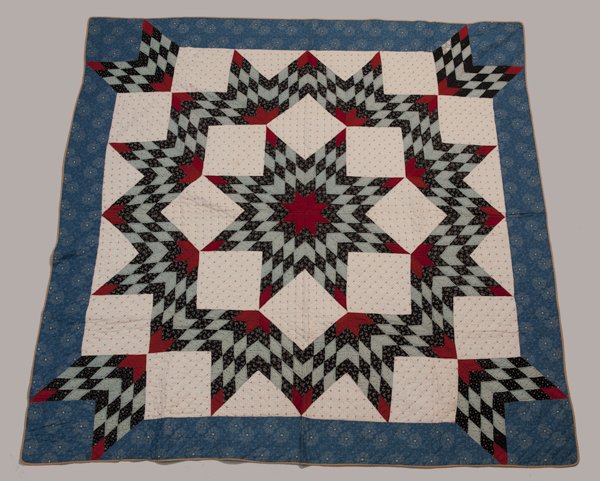 Hermann, Missouri Pieced Quilt, Ca. 1870 - 1889,: Hermann, Missouri Pieced Quilt, Ca. 1870 - 1889, Broken Star pattern, calicos, prints and red fabrics, wide blue border, one light stain 80"" x 80""