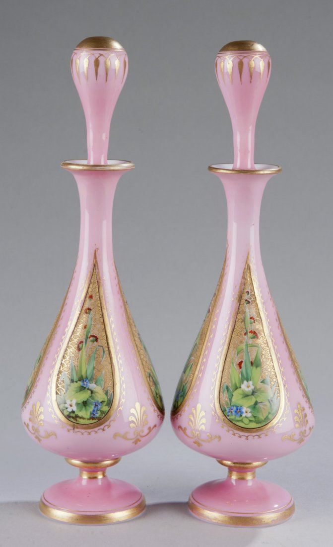 Pair of French Opaline Scent Bottles: Pair of French Opaline Scent Bottles Possibly from the last quarter of the 19th century. Each having a pink ground with teardrop form reserves decorated with polychrome flower and leaves. 10"" H