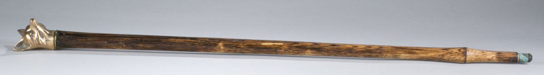 One (1) Walking Cane with Brass Fox Head: One (1) Walking Cane with Brass Fox Head Base of fox marked with a ""B"". 35 1/2"" L