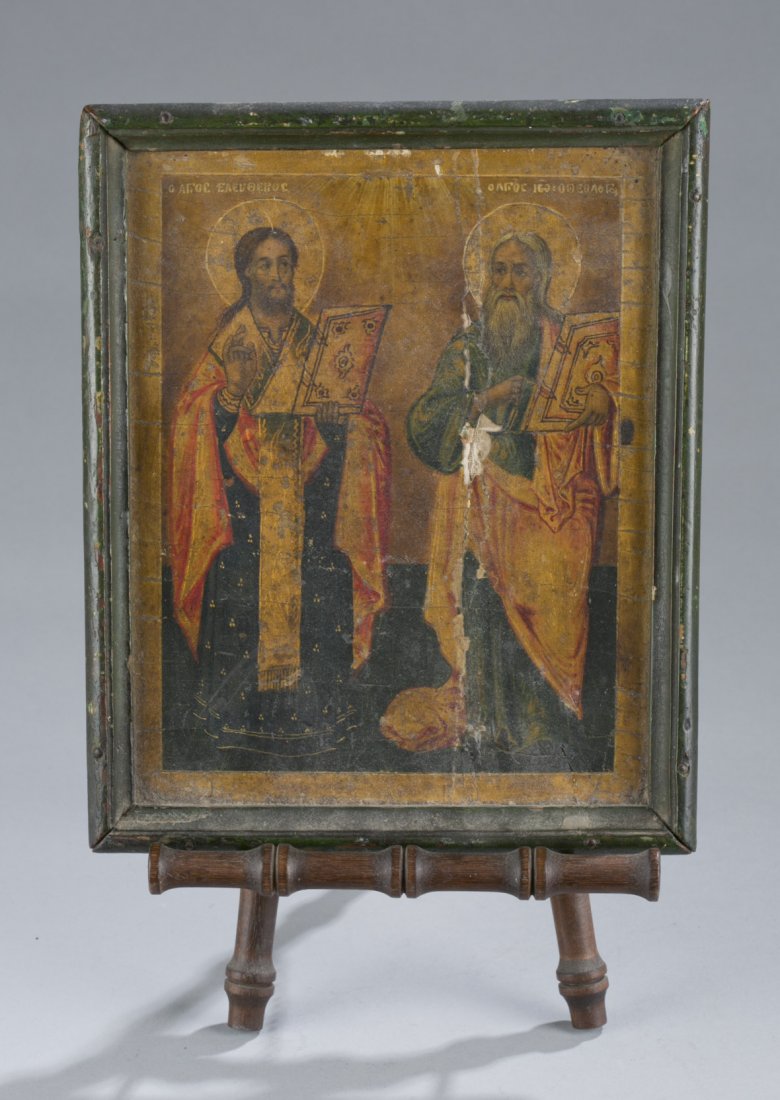 Greek or Russian Icon in Gilt Frame: Greek or Russian Icon in Gilt Frame Jesus and father painted on plaster with canvas backing. Displayed on wooden stand. Cracks to plaster and losses to painting on father figure. Cyrillic writing abov