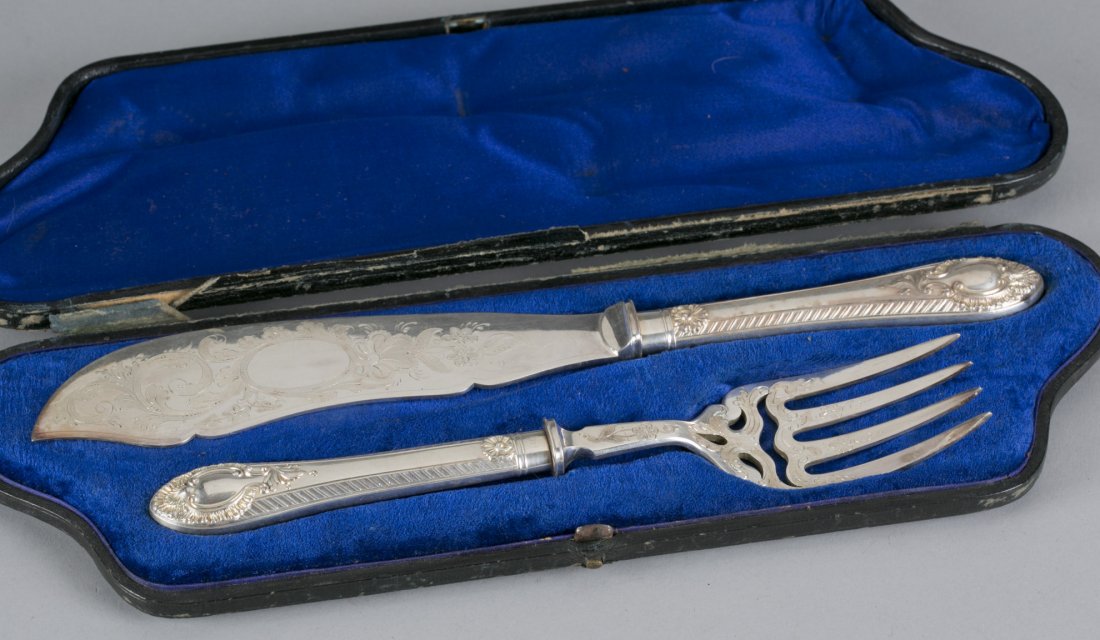 MK & Co. Silver Plate Serving Fork and Knife in Case: MK & Co. Silver Plate Serving Fork and Knife in Case Engraved floral and scroll pattern with open cartouches. Blue velvet lined case. Largest 11 3/4""