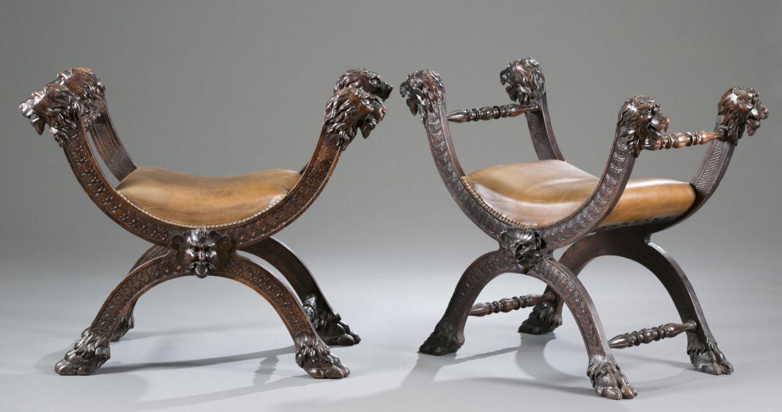 Renaissance Revival Carved Oak Chairs: Renaissance Revival Carved Oak Chairs Lion themed with four lion head posts and tacked leather seats. Curved base terminating on lion paw feet. Figural face and shell carving on center of skirt. 28""