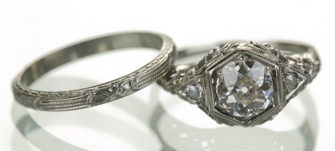 18K White Gold .92 ct Diamond Edwardian Wedding Set: 18K White Gold .92 ct Diamond Edwardian Wedding Set Containing central mine cut diamond, I1-I2 clarity, L-M color measuring 6.30 x 3.65mm. Flanked by two small round brilliant diamonds, .04 tcw. Size 