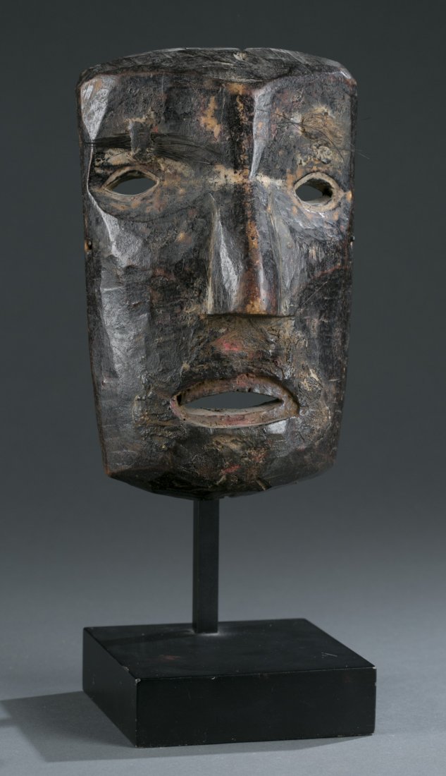 Carved Wooden Inuit Mask on Stand: Carved Wooden Inuit Mask on Stand Rectangular face with primitive facial features. Mask 8 1/2"" H x 5 1/2"" W, stand 4 3/4"" H