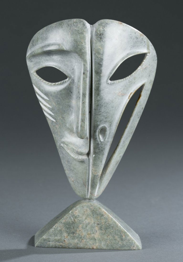 David Ruben Piqtoukun, (b. 1950), Inuit Raven Mask,: David Ruben Piqtoukun (b. 1950) Inuit Raven Mask Soapstone with Inset Marble Orb Signed and dated 2006, appears to depict a half bird / half man face. 8"" H x 4 3/4"" W