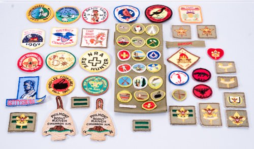 Large Lot of Boy Scouts of America Merit Badges and: Large Lot of Boy Scouts of America Merit Badges and Camp Patches To include (55 pieces): Boy Scout sash with 16 merit badges, 5 loose merit badges, 15 camp patches and more. 3"" D
