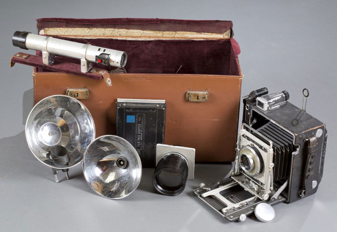 Graflex Graphic Camera Set: Graflex Graphic Camera Set To include: leather Graflex carrying case containing one (1) Graflex Graphic Speed Camera with film pack adapter and synchronizer battery, one (1) 15in lens, marked ""Taylor
