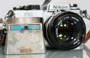 Bag of Assorted Cameras and Related Accessories: Bag of Assorted Cameras and Related Accessories To include one (1) Rolleiflex 75mm camera with original case, lens marked ""Schneider-Kreuznach,"" one (1) Nikon FE2 with 50mm lens, one (1) Lyca carryi
