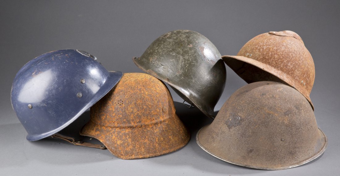 Five (5) Assorted Military Helmets: Five (5) Assorted Military Helmets To include: four (4) vintage metal military helmets, one painted green, one (1) hard blue plastic vintage work helmet. Largest: 12 1/2'' W x 6 1/4'' H