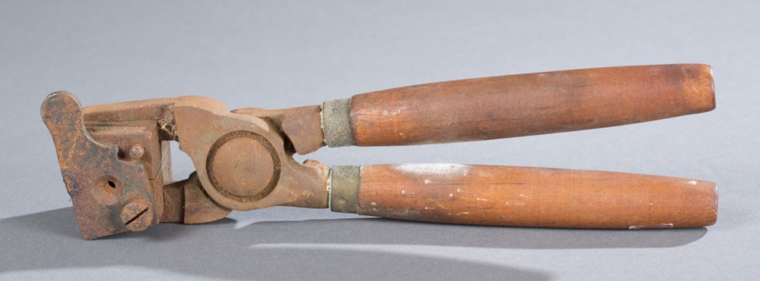 Musket Ball Mold and Powder Shot Tools: Musket Ball Mold and Powder Shot Tools Musket ball mold with wooden handles and rusted iron instruments. labeled, ""Ideal Middlefield, Conn, USA"". Powder shot told with wooden handle and steel instru