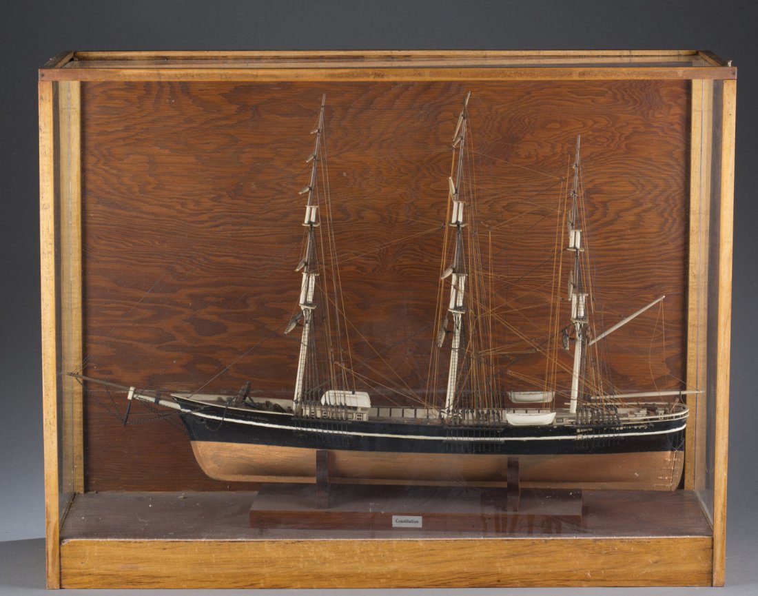Model of "Constitution" in a Glass Display Box: Model of ""Constitution"" in a Glass Display Box Hand painted ship's model of ""Constitution,"" possibly attributed to the U.S.S. Constitution. Includes wooden display box with glass panes. Box: 20 1/