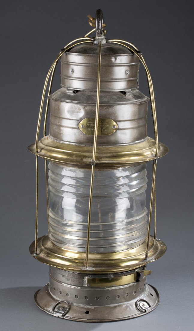 Brass and Tin Ship's Lantern: Brass and Tin Ship's Lantern Large brass and tin double tier, birdcage style anchor lantern with colorless Fresnel lens. Labeled with brass plate on top tier states, ""Manufactured by McBean Edge & Co