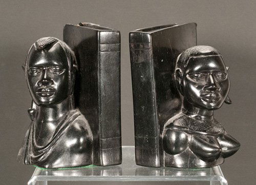 Pair of African Themed Ebony Bookends: Pair of African Themed Ebony Bookends One is chipped to the back. 5 1/2"" H