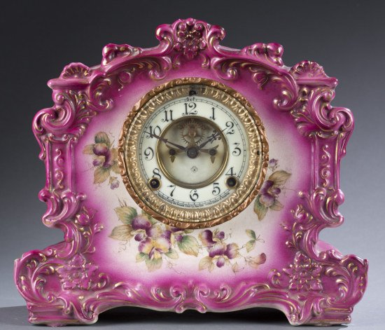 Handpainted Porcelain Ansonia Mantle Clock: Handpainted Porcelain Ansonia Mantle Clock Highly figural with decoration, enameled clock. Marked ""Ansonia Clock C.o. New York"" Record model. Chip to lower left. 11"" H x 13"" W x 4 1/2"" D