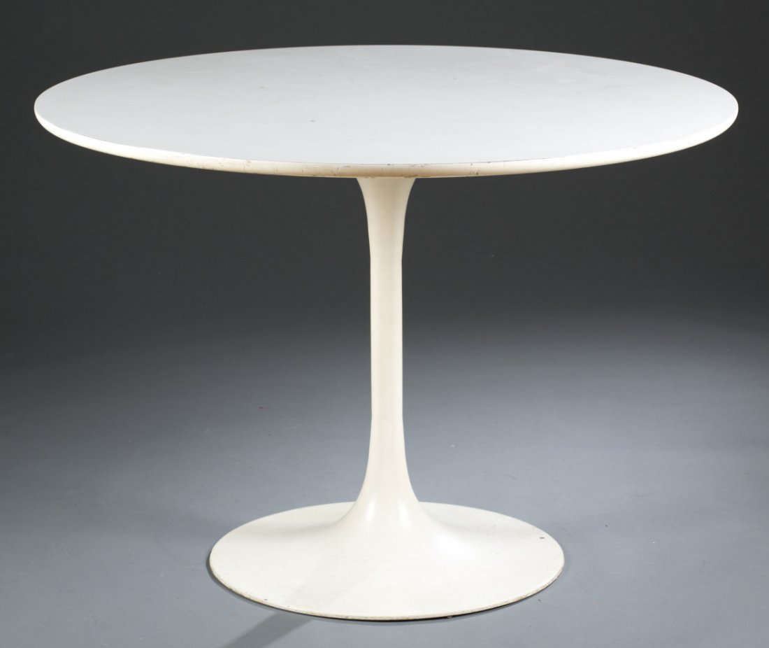 Style of Eero Saarinen Tulip Table: Style of Eero Saarinen Tulip Table Dining table form. Laminated top and heavy cast aluminum base. 28 1/4'' H x 41 3/4'' Dia