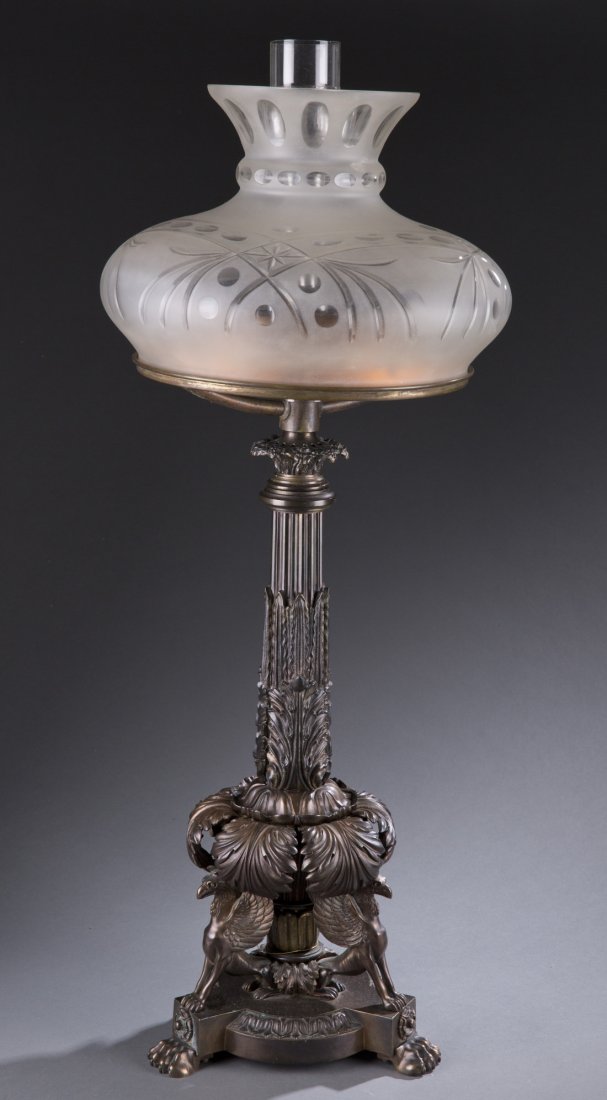 English Sinumbra Lamp, Mid 19th Century: English Sinumbra Lamp, Mid 19th Century Bronze Sinumbra lamp with a frosted, cut and etched glass shade over a acanthus decorated column supported by sculpted Griffins. Figures on paw feet. Dark bronz