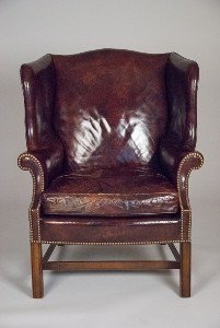 Leather Wingback Chair with Nailhead Trim: Leather Wingback Chair with Nailhead Trim Leather is slightly distressed to seat. 40 1/2"" H x 30 1/4"" W x 28"" D