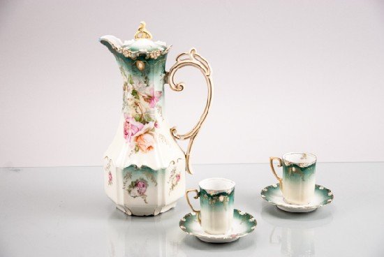 Five Piece Prussian Chocolate Set: Five Piece Prussian Chocolate Set To include (five pieces): Pitcher, two teacups with saucers. 12"" H x 7"" W