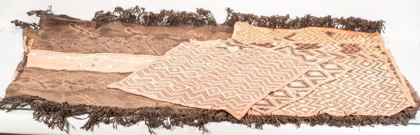 Hand Woven African Tablecloth Decorated with Shells and: Hand Woven African Tablecloth Decorated with Shells and Fringe, along with Six (6) Placemats Placemats vary in size and pattern design Tablecloth: 87"" L x 52"" W