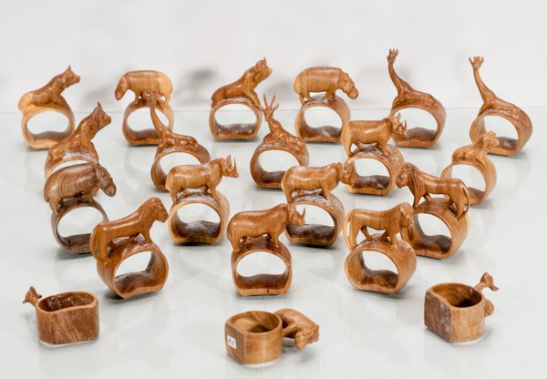 Twenty-One Wooden Carved Napkin Rings: Twenty-One Wooden Carved Napkin Rings Lot of twenty-one wooden carved napkin holders with animal on each ring. Animals include giraffe, rhinoceros, impala, water buffalo, lion, and hippo. Each carved 