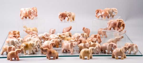 Fifty (50) Carved Kisii Elephants: Fifty (50) Carved Kisii Elephants Elephants are carved in a variety of positions. Medium sized. Soapstone. African. Varying Around: 2 5/8'' H x 3 1/2'' L