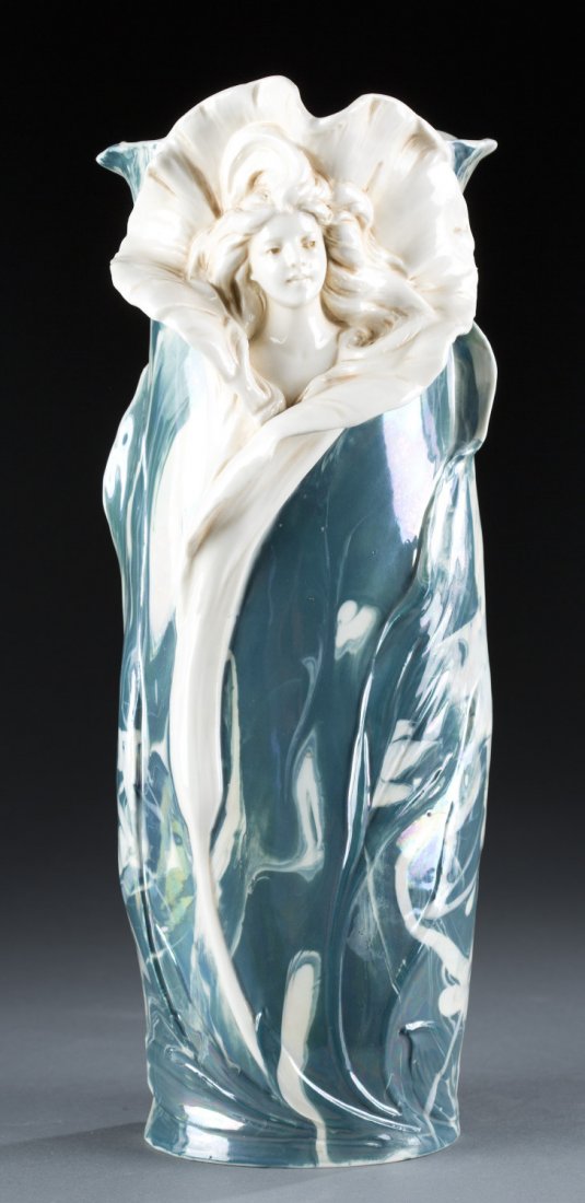 Ca. 1900 Royal Dux Bohemia Porcelain Vase: Ca. 1900 Royal Dux Bohemia Porcelain Vase Art Nouveau style with woman's bust emerging from unfolding flower. Marked on base, "5151" and "E" in center of pink clay triangle. 14" H x 5" Diameter