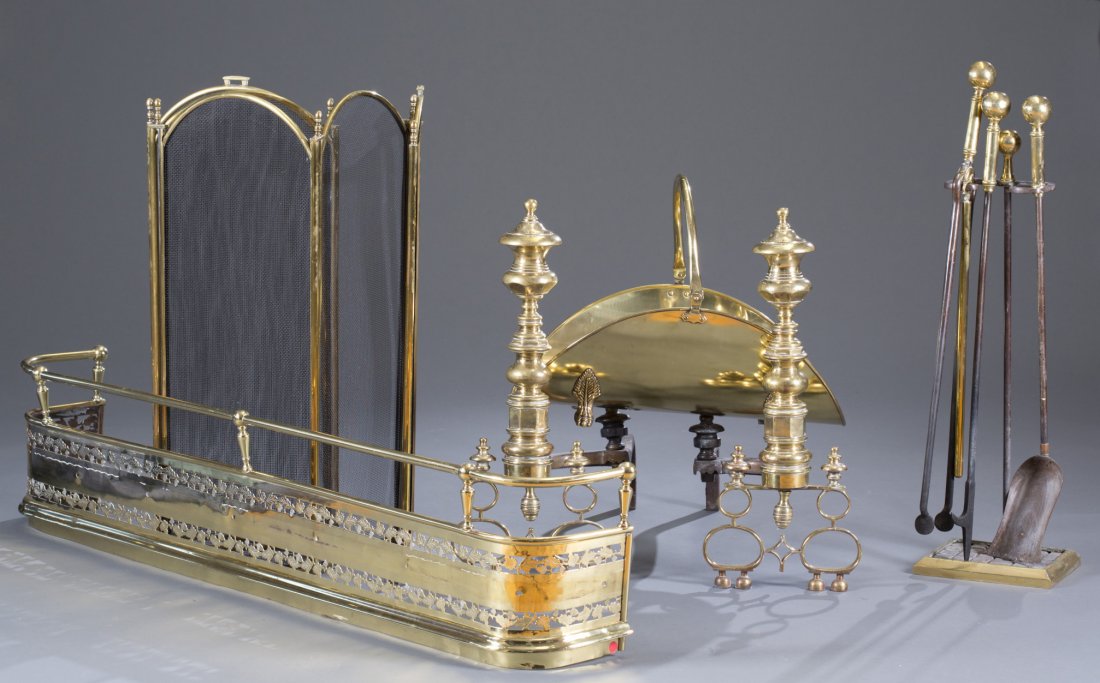 Six Piece Classical Brass Fireplace Set: Six Piece Classical Brass Fireplace Set Consisting of tall turned andirons, pierced acorn motif fender, tools on stand, five panel folding screen and log basket. Andirons: 26" H