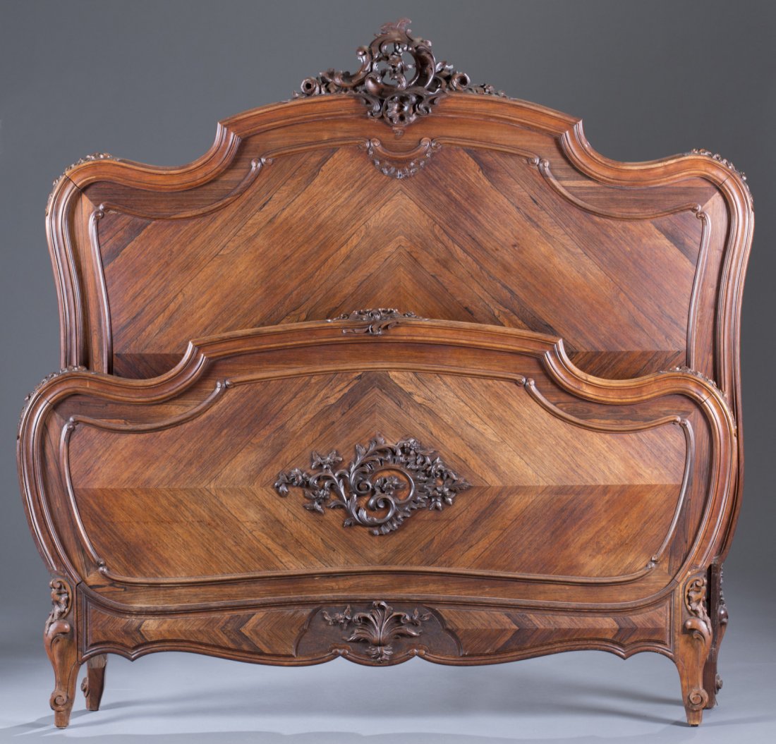 Rococo Style Rosewood Carved Bed: Rococo Style Rosewood Carved Bed 2nd Half of the 19th Century. Extensive finger carving. Floral carved crest and accents. Applied open foliate carving. Rails included. Accomodates 54" mattress. 62" x 