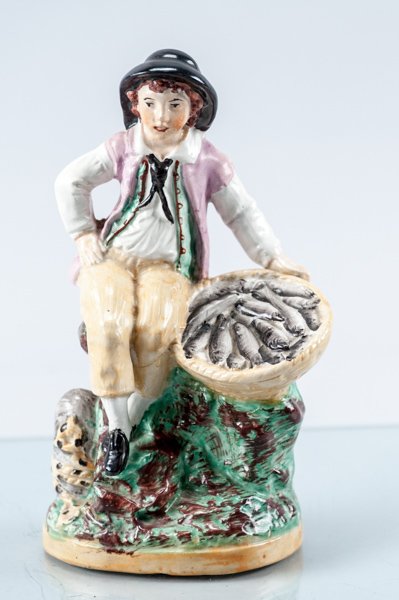 Staffordshire Model Boy with Fish Basket: Staffordshire Model Boy with Fish Basket Staffordshire-ware, England, Ca. 1990, Good Condition. 8" H Provenance: The estate of the late Honorable Robert W. Daniel, Jr. of Brandon in Prince George, VA