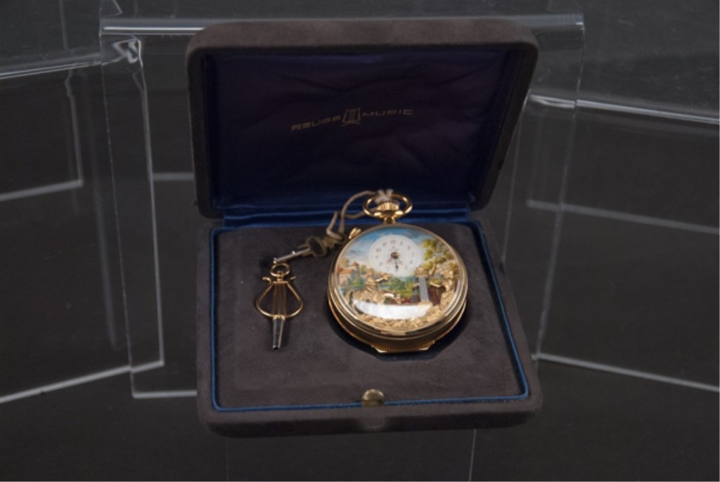 Early to Mid 20th Century Reuge Music Pocket Watch: Swiss. Three dimensional work of art, encompassing a pocket watch with alarm, an automated motion scene and music. Movement keeps in time with music (Oh, what a beautiful morning!) and are wound separ