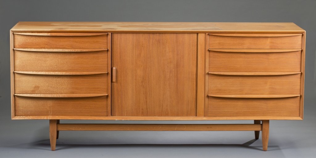 Falster Teak Credenza: Eight drawers with center cabinet. 31 3/4" H x 75" W x 19" D