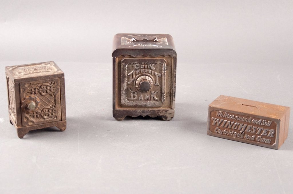 Three Cast Metal Banks: Two "Safe" forms and a Winchester Guns