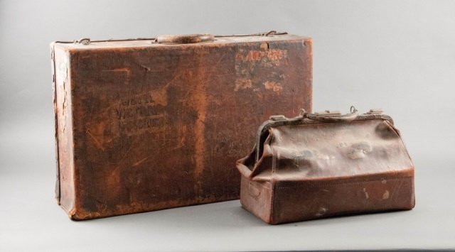 Antique Louis Vuitton Suitcase and a Vanity Case: Ca. 1900's or earlier. All original brass hardware marked Louis Vuitton. Initials to the top, Stamped to inside Paris Louis Vuitton London. Heavily worn. Unmarked vintage vanity case. 16 1/2" H x 25 3